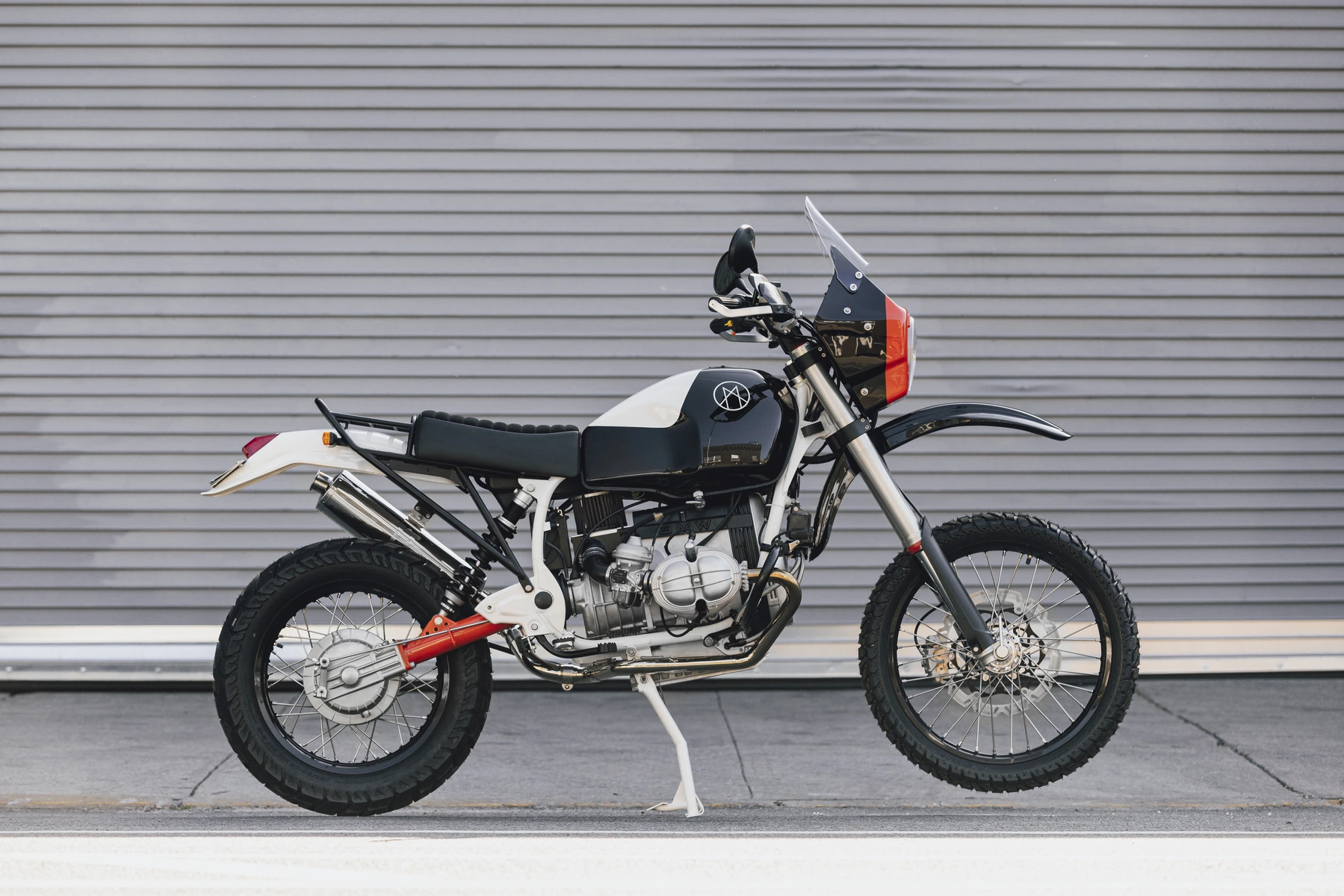 Side view of the grey Myth 002 adventure motorcycle