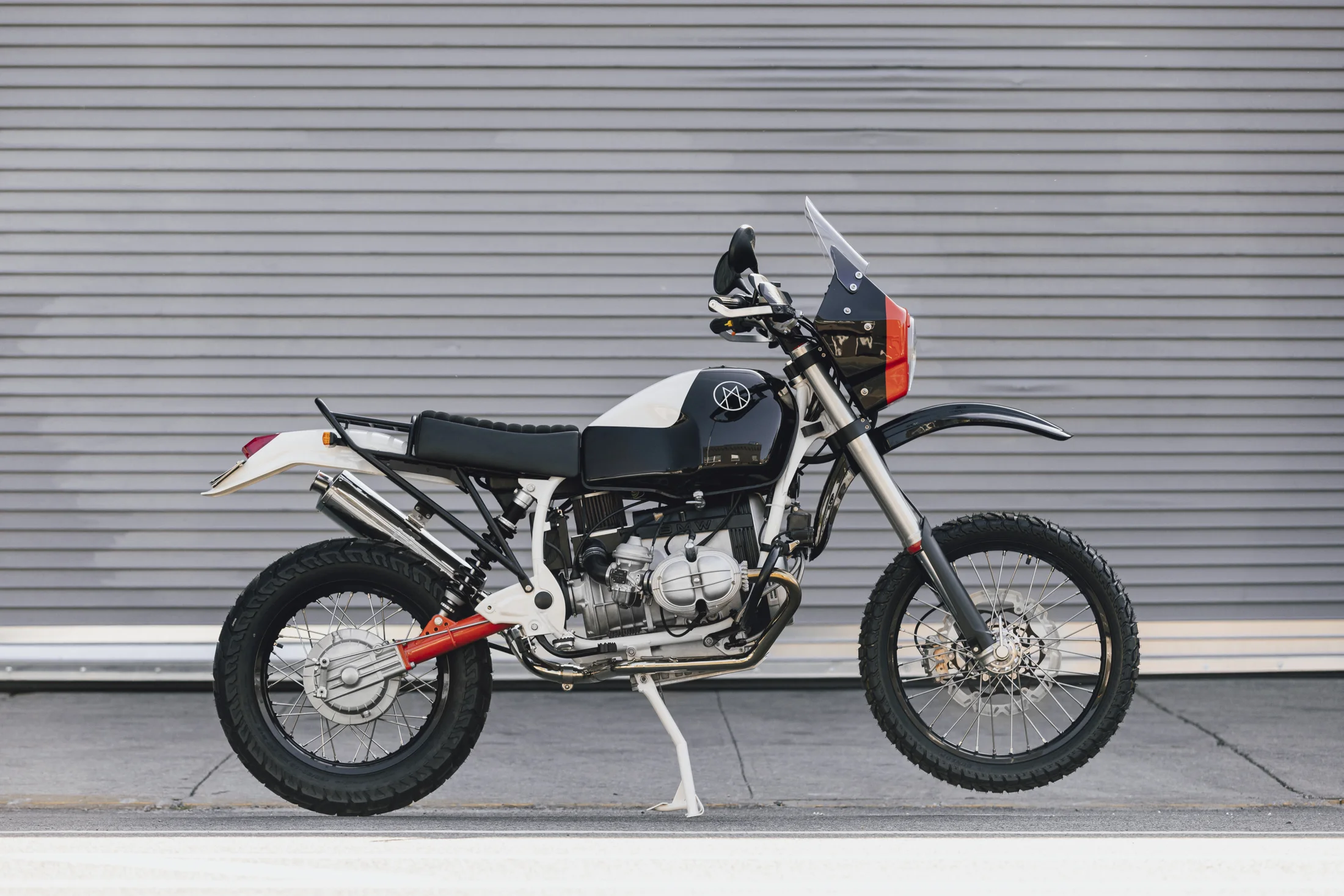 Side view of the grey Myth 002 adventure motorcycle