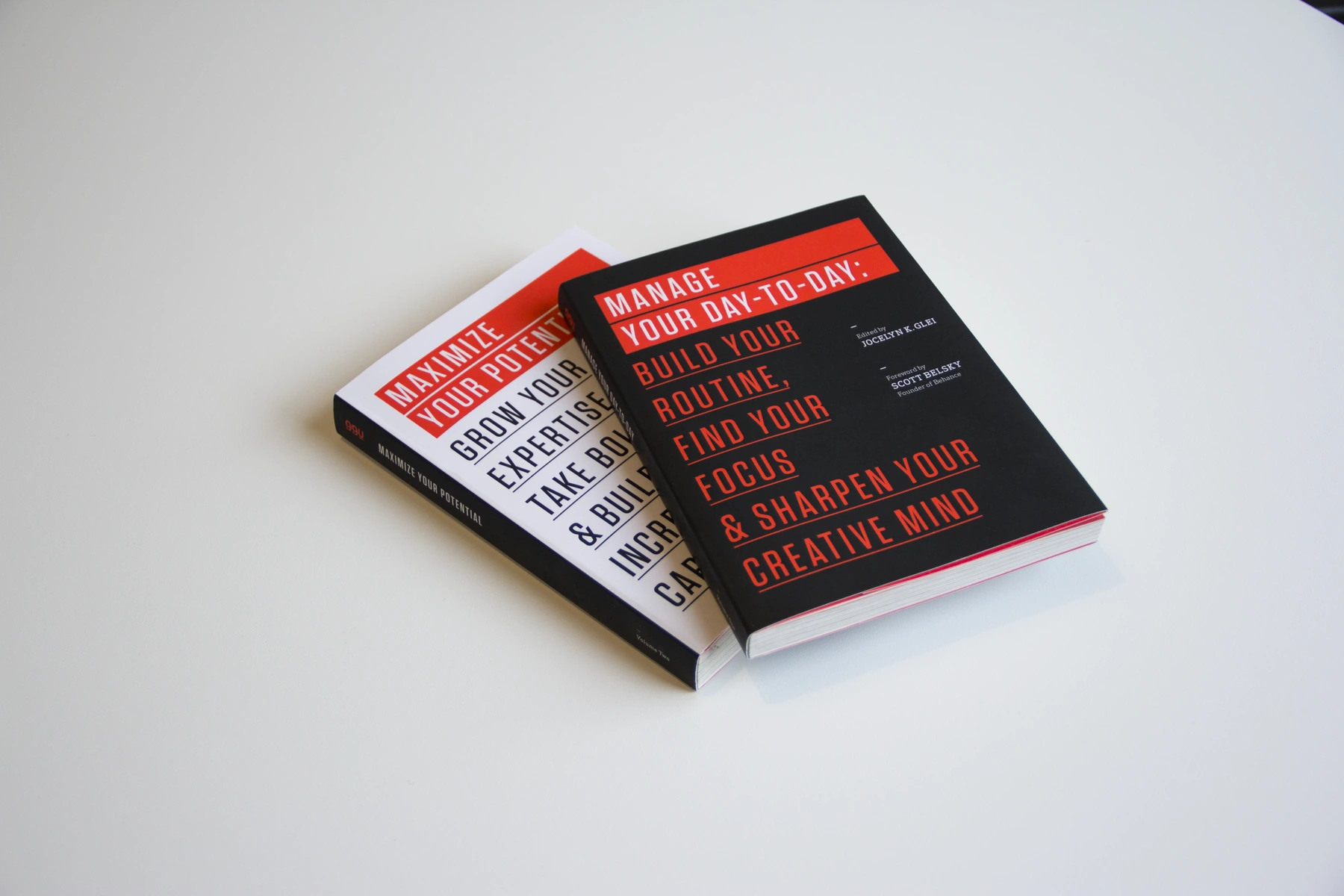 Stacked 99U Manage Your Day-to-Day books with red, black and white covers