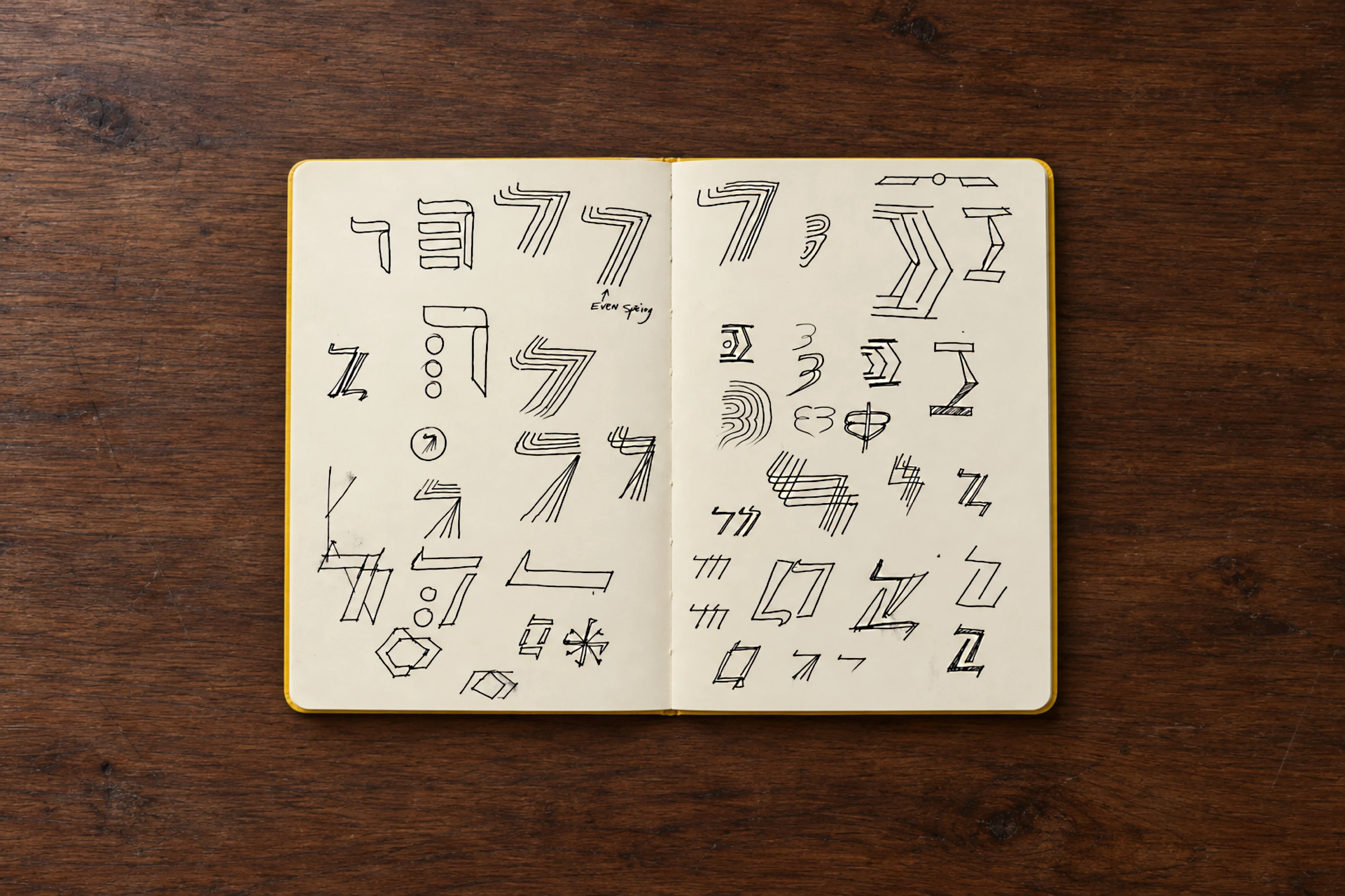 Sketchbook of hand-drawn Dalet letter and symbol explorations